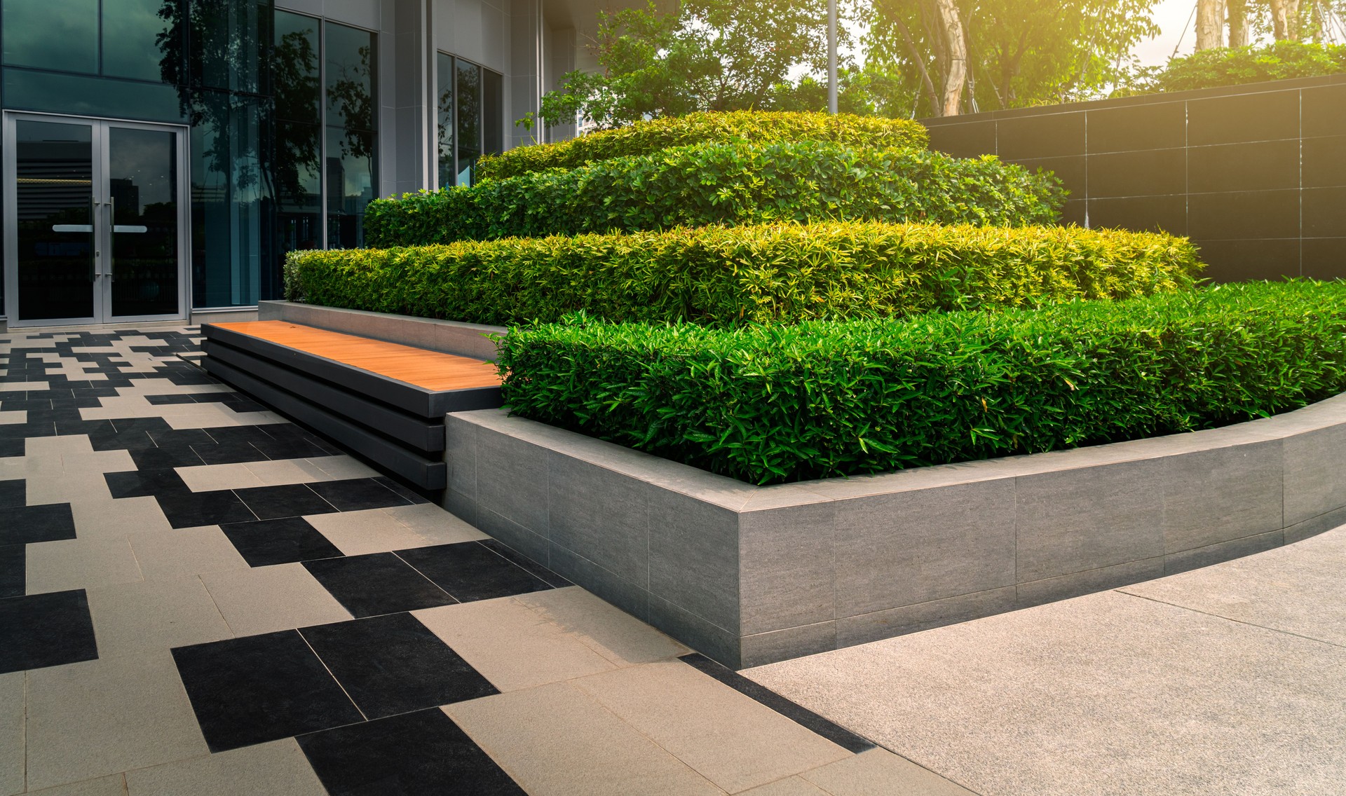 Outdoors gardening decoration with bench of an modern office building